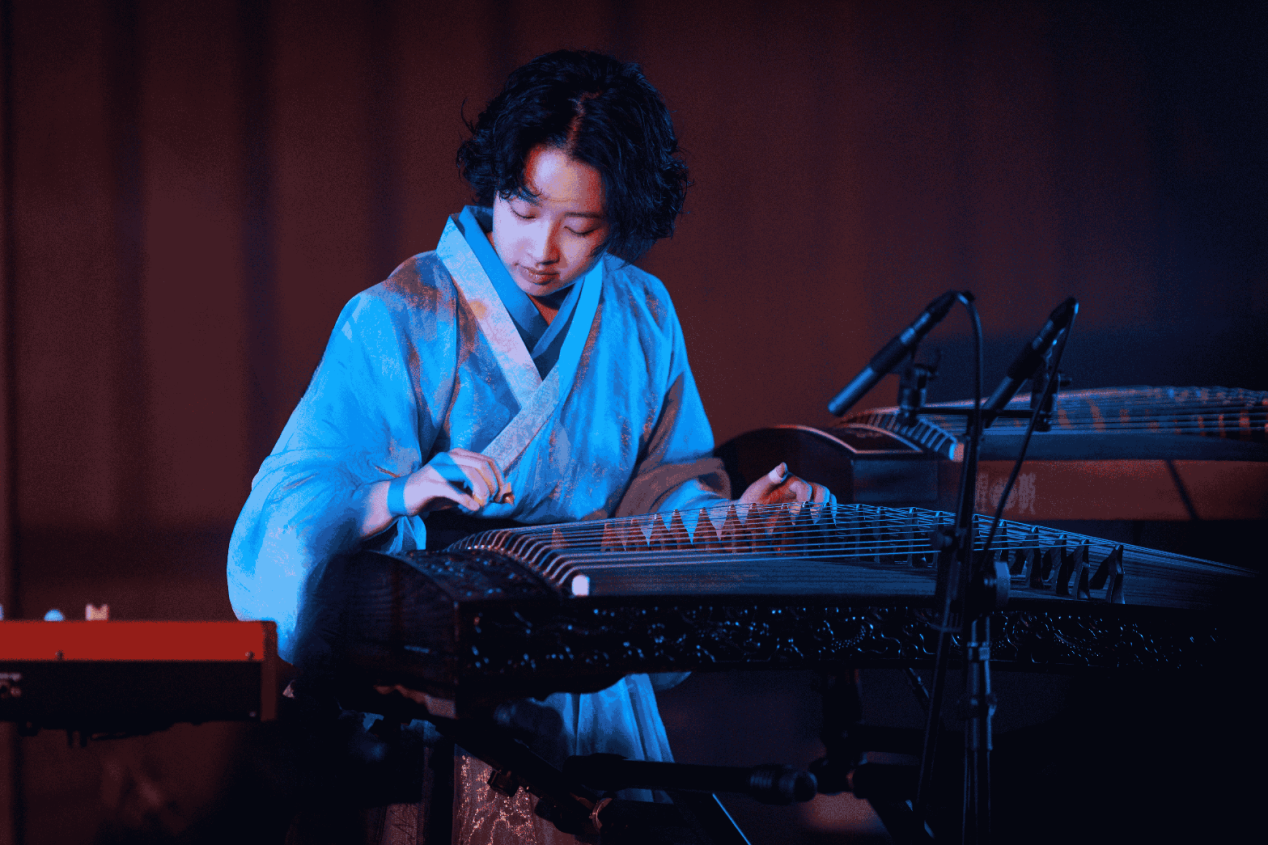 QiQi performing guzheng in Elysian Blues, a contemporary classical performance combining Chinese musical traditions, jazz and improvisation.